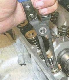 приспособление для снятие маслосъемых колпачков